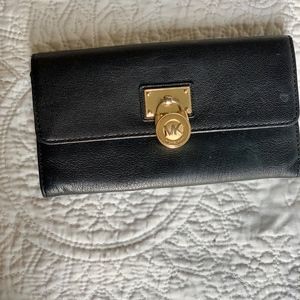 Black and yellow gold Michael Kors bi fold wallet
